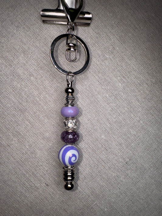 A swirl of color, a touch of charm Handmade Purple Swirl Beaded Keychain